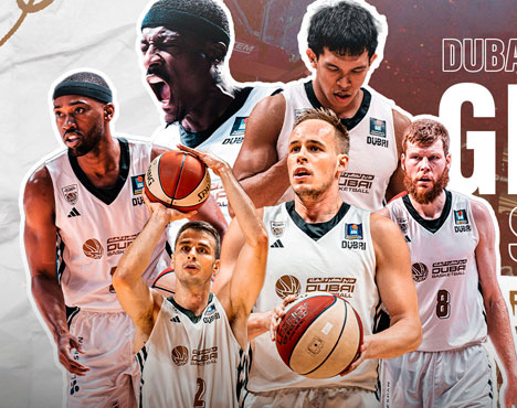 На изображении группа баскетболистов в форме команды Dubai Basketball. Фоном служат крупные портреты игроков в динамичных позах, добавляющие энергии композиции. Видны логотипы команды и детали мяча